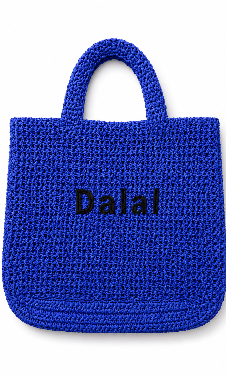 Blue woven handbag with 'Dalal' branding on a white background